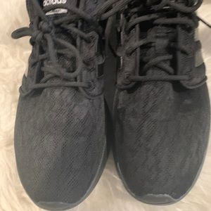 Woman’s size 11 adidas black lace like pattern